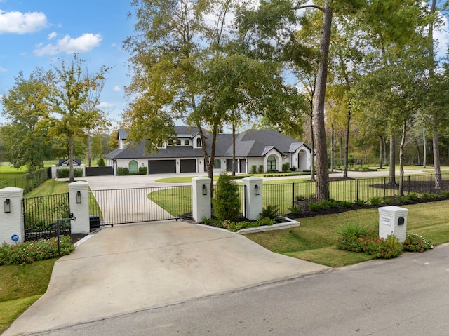 view of front of home with a garage and a front yard