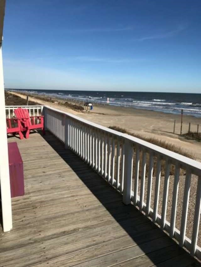 exterior space with a water view and a view of the beach