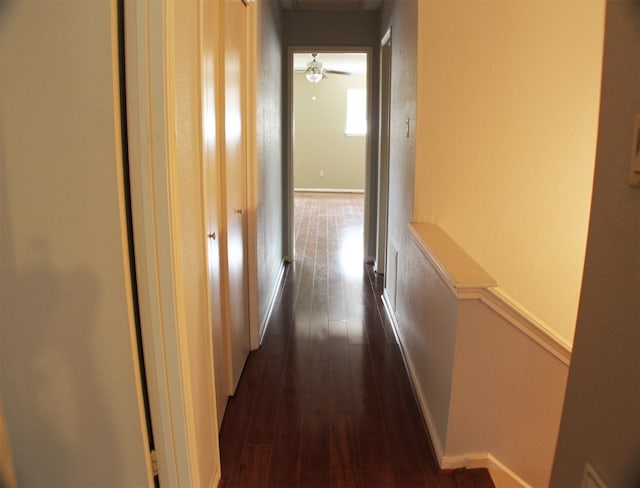 hall with dark wood-type flooring