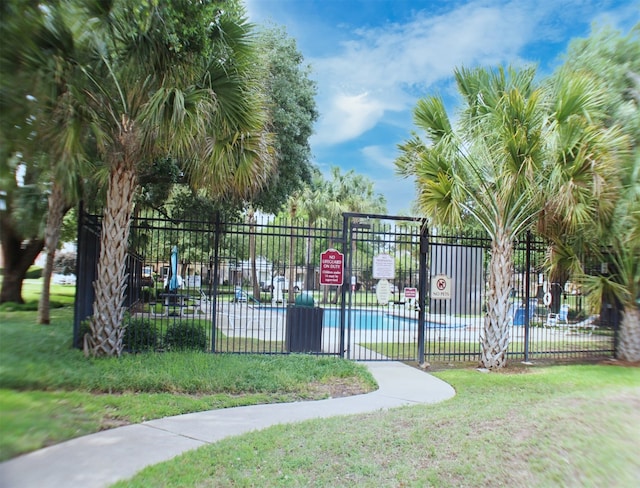 view of home's community with a yard