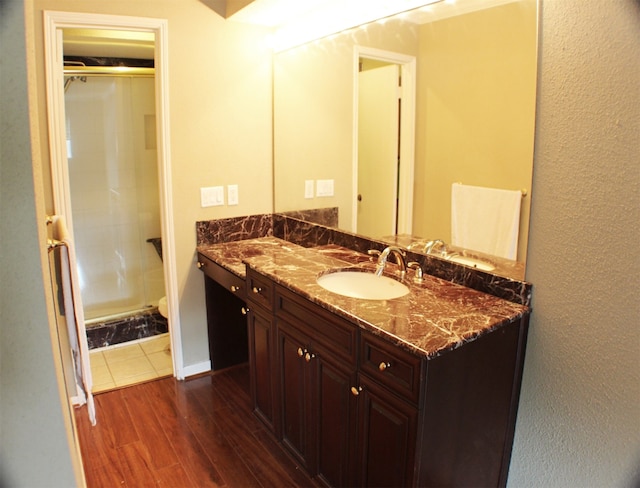 bathroom with oversized vanity and hardwood / wood-style flooring