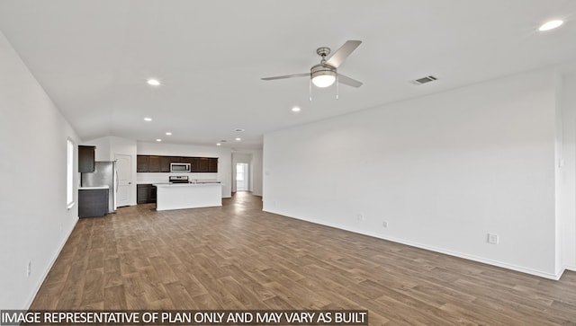 unfurnished living room with ceiling fan and hardwood / wood-style flooring