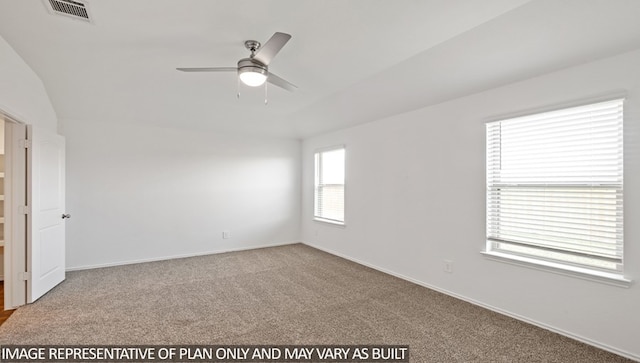 carpeted empty room featuring ceiling fan and lofted ceiling