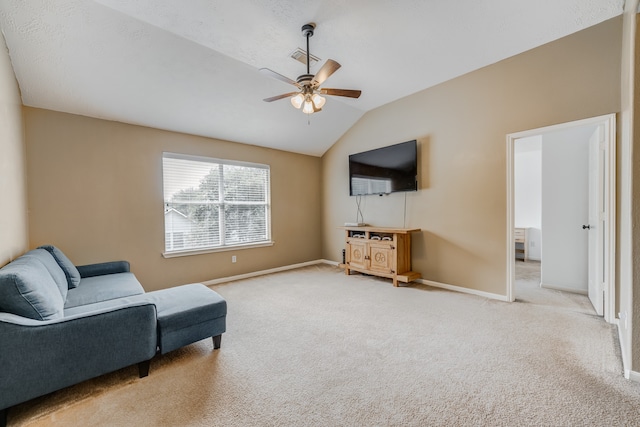 living area with light colored carpet, ceiling fan, and lofted ceiling