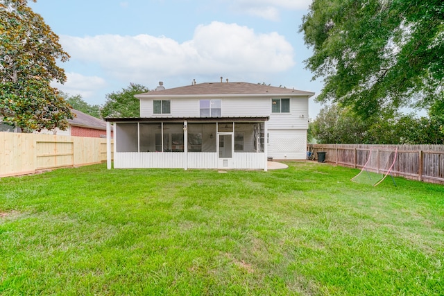 back of property featuring a yard and a sunroom