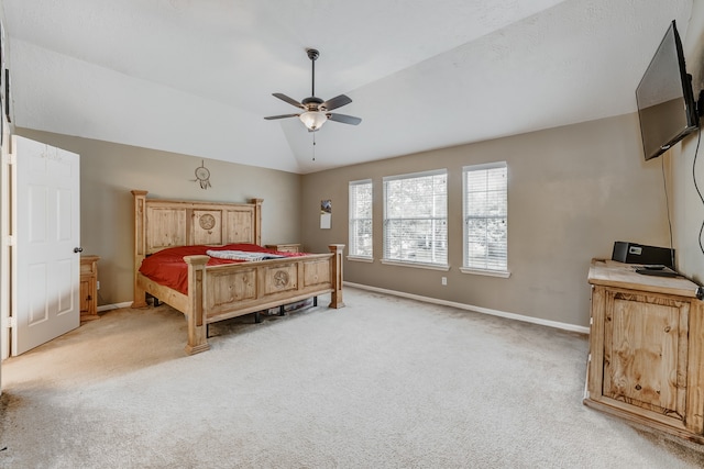 carpeted bedroom featuring lofted ceiling and ceiling fan