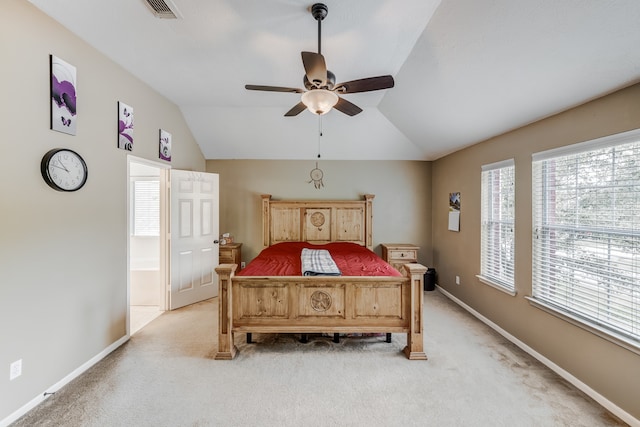 carpeted bedroom featuring ceiling fan and vaulted ceiling