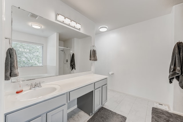 bathroom featuring tile floors and oversized vanity