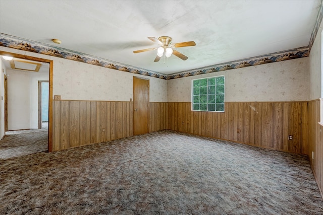 carpeted spare room with ceiling fan