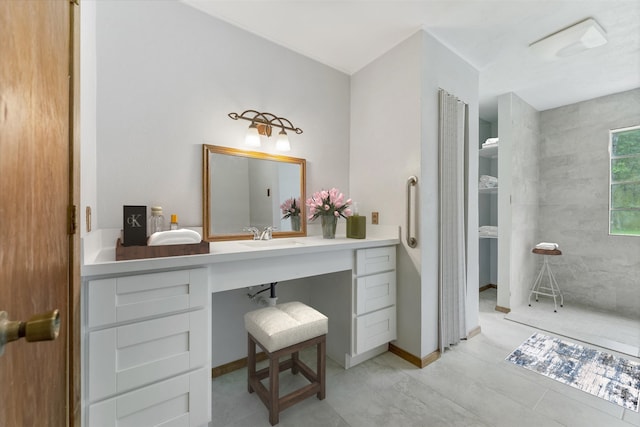 bathroom with tile flooring and vanity