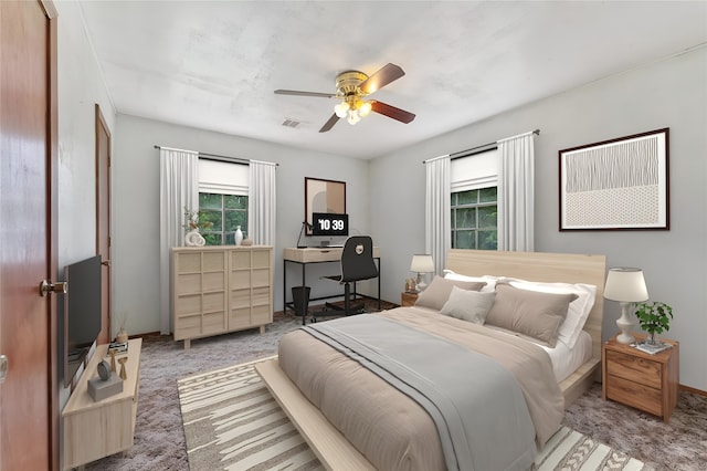 carpeted bedroom featuring ceiling fan