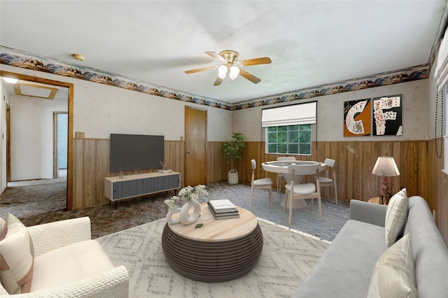 living room with carpet and ceiling fan