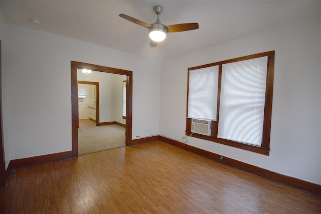 spare room featuring ceiling fan and hardwood / wood-style flooring