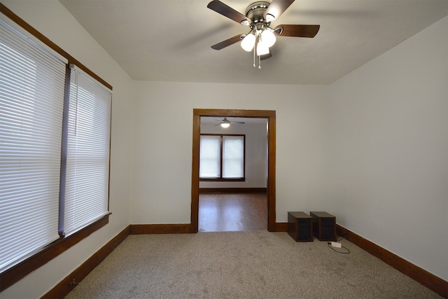 spare room featuring ceiling fan and hardwood / wood-style flooring