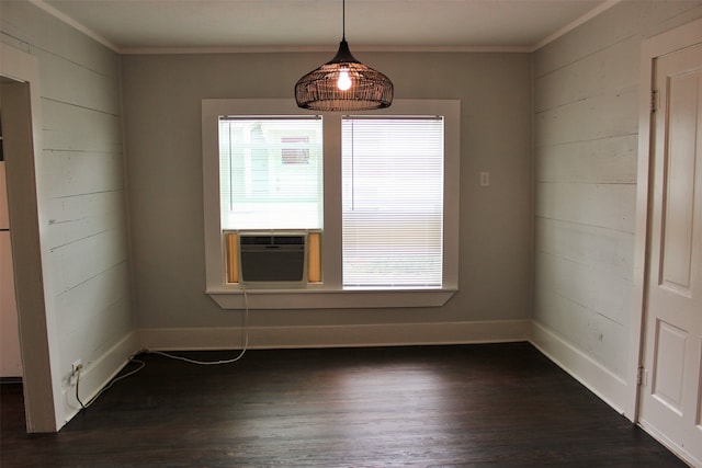 unfurnished room with ornamental molding and dark wood-type flooring