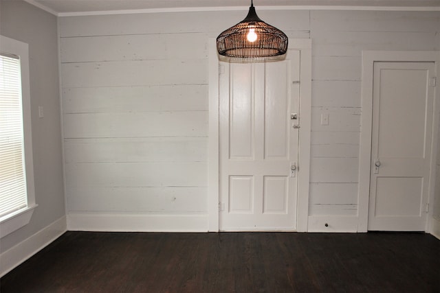 interior space with dark wood-type flooring and crown molding