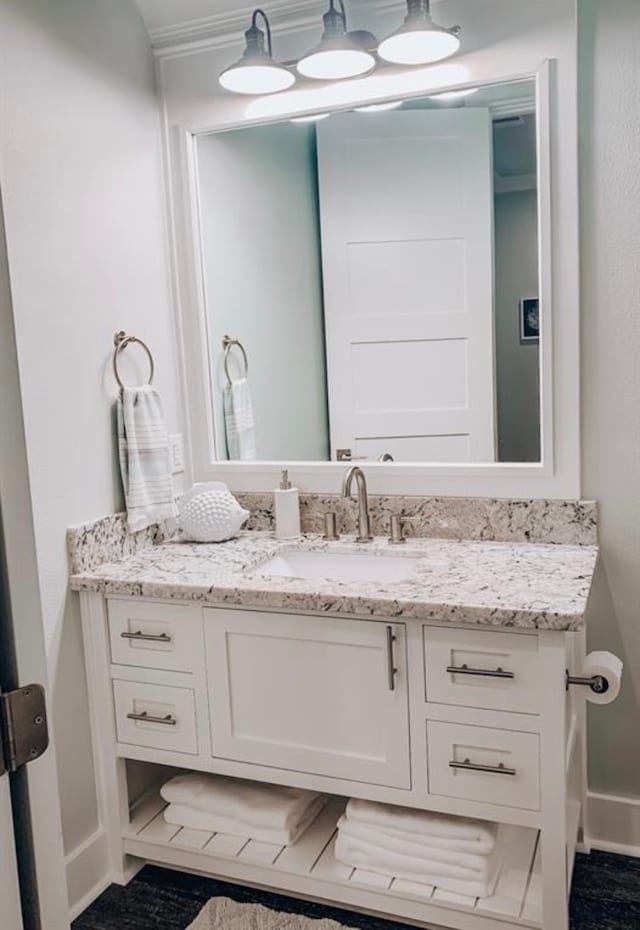 bathroom featuring tile floors and vanity