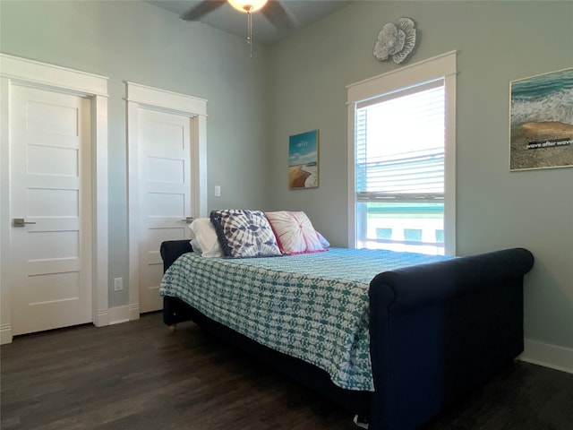 bedroom featuring dark hardwood / wood-style flooring and ceiling fan