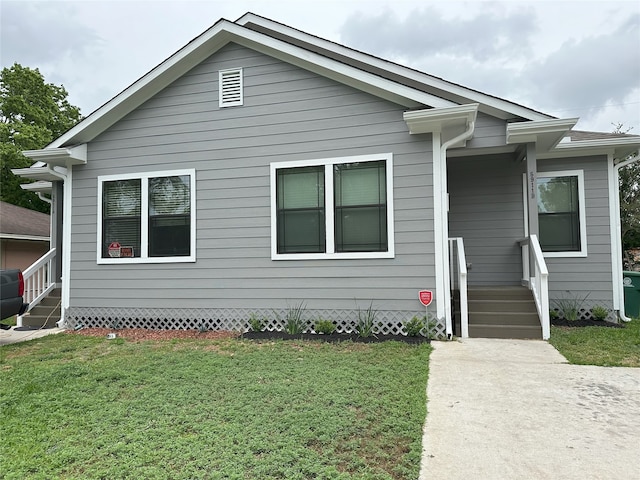 bungalow with a front lawn