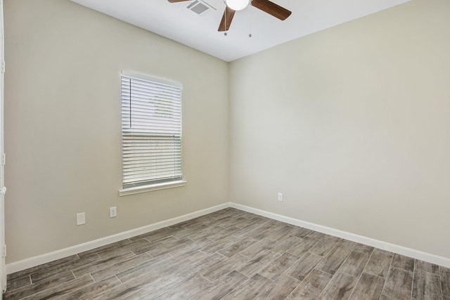 empty room featuring light hardwood / wood-style floors and ceiling fan