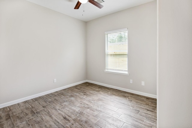 empty room featuring ceiling fan and light hardwood / wood-style floors