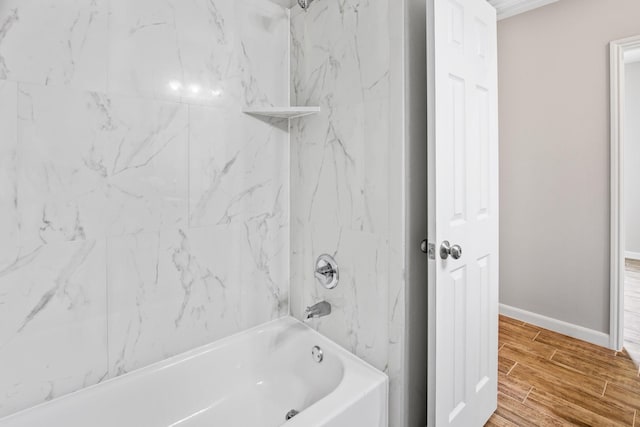 bathroom with tiled shower / bath combo