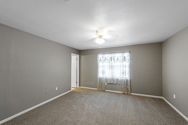 1329 Fountain View Dr Unit 135, Houston, TX 77057 - unfurnished room featuring a textured ceiling, carpet floors, and ceiling fan