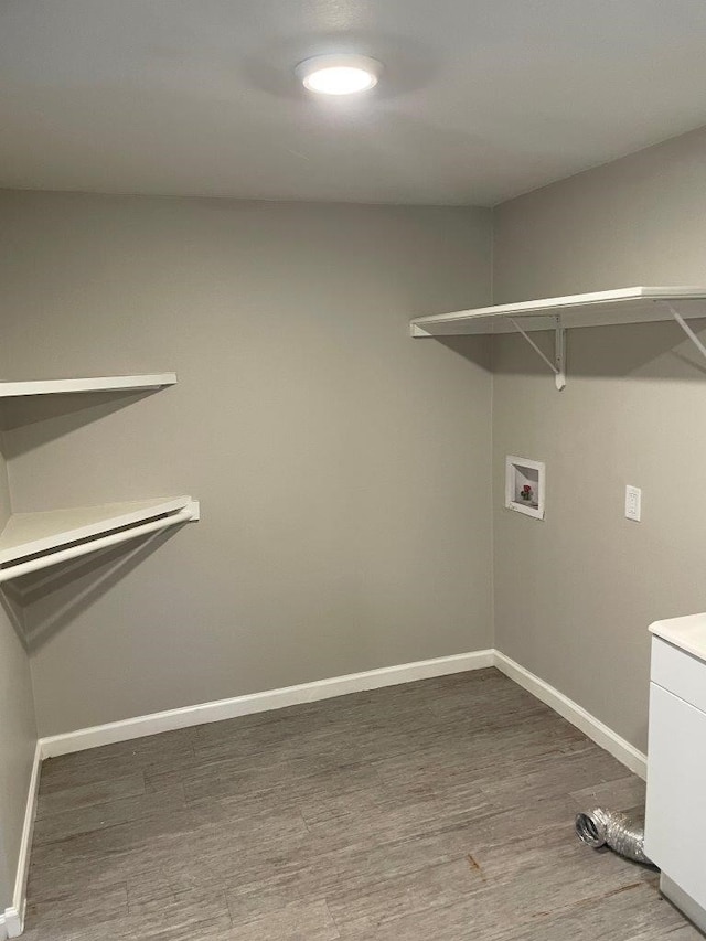 laundry area featuring wood-type flooring and hookup for a washing machine