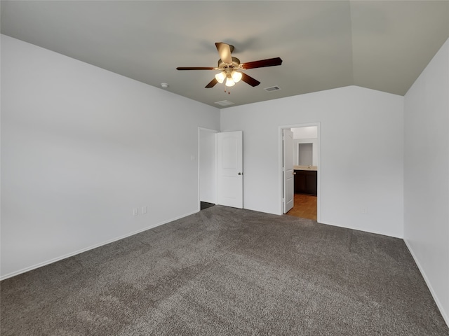 tiled empty room featuring lofted ceiling and ceiling fan