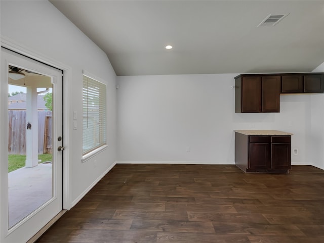 unfurnished living room with dark hardwood / wood-style flooring and vaulted ceiling