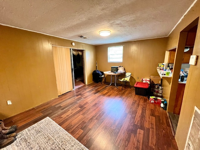 misc room featuring hardwood / wood-style floors and a textured ceiling