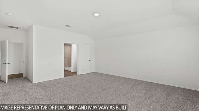 unfurnished bedroom with lofted ceiling and carpet floors