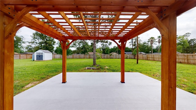 view of patio with a pergola and a storage shed