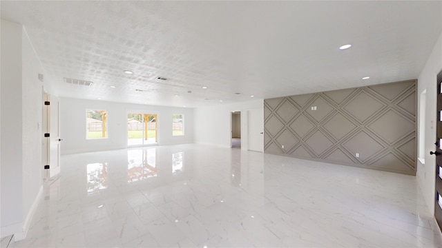 spare room featuring light tile flooring