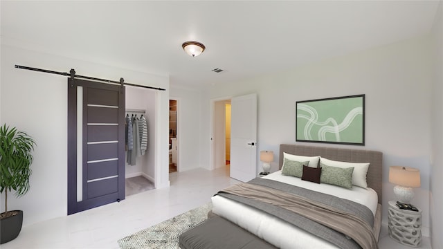 tiled bedroom with a barn door and a closet