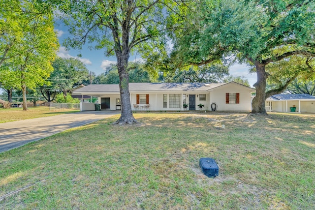 single story home with a porch and a front yard