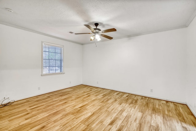 spare room with ornamental molding, a textured ceiling, light hardwood / wood-style floors, and ceiling fan