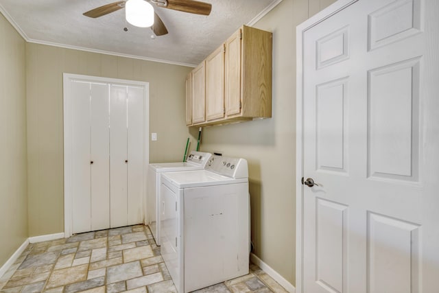 washroom featuring separate washer and dryer, a textured ceiling, ceiling fan, ornamental molding, and cabinets