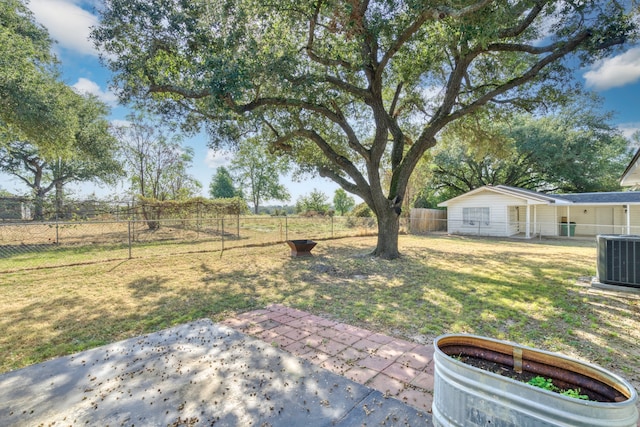 view of yard with a patio and central AC unit