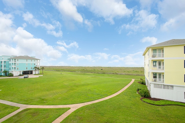 view of home's community featuring a lawn