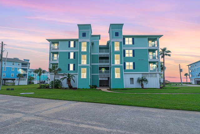 view of outdoor building at dusk