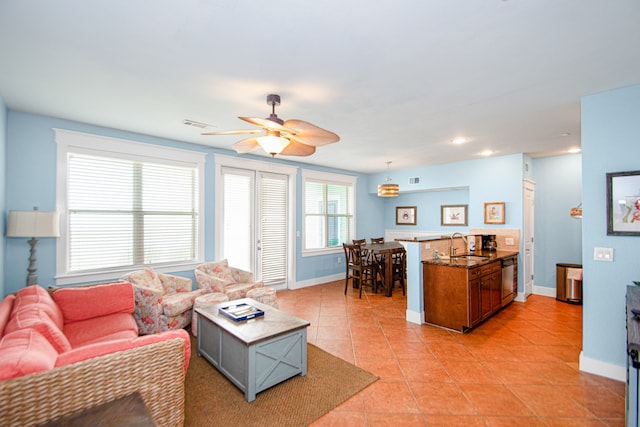 tiled living room with sink and ceiling fan