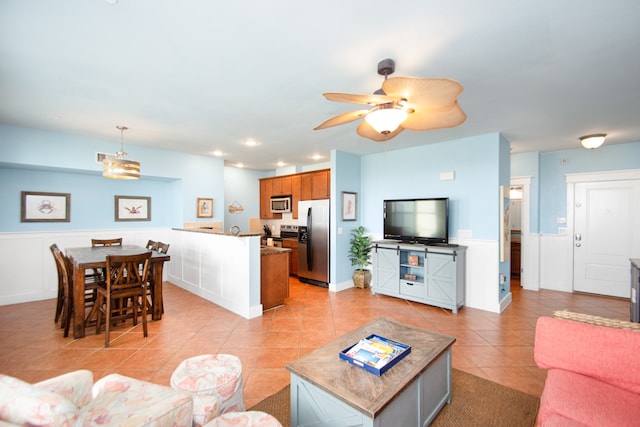 tiled living room featuring ceiling fan