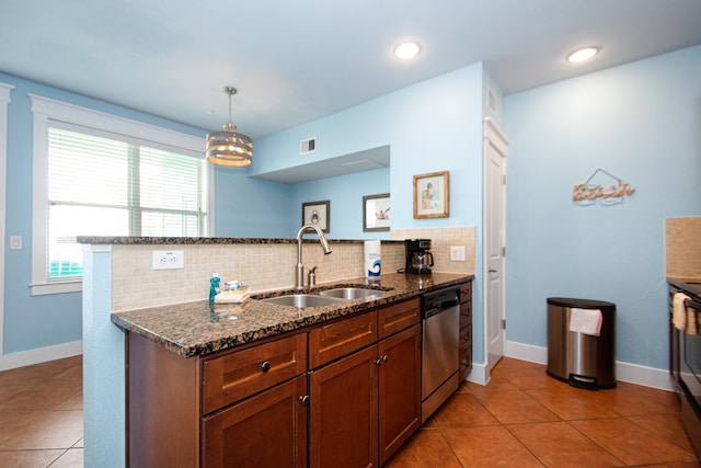 kitchen featuring stainless steel dishwasher, sink, tasteful backsplash, and light tile flooring