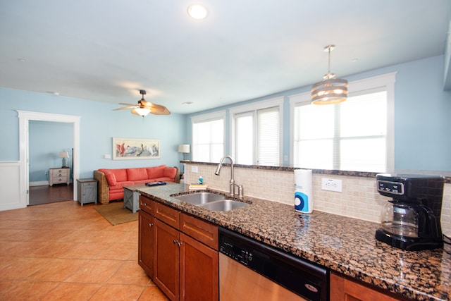 kitchen featuring pendant lighting, backsplash, sink, dishwasher, and ceiling fan