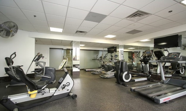 workout area featuring a paneled ceiling