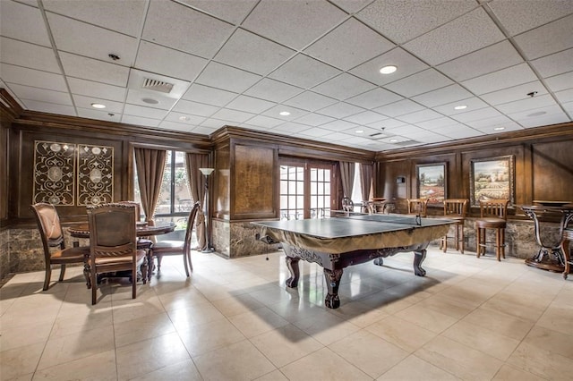 recreation room with a paneled ceiling, pool table, light tile flooring, and french doors