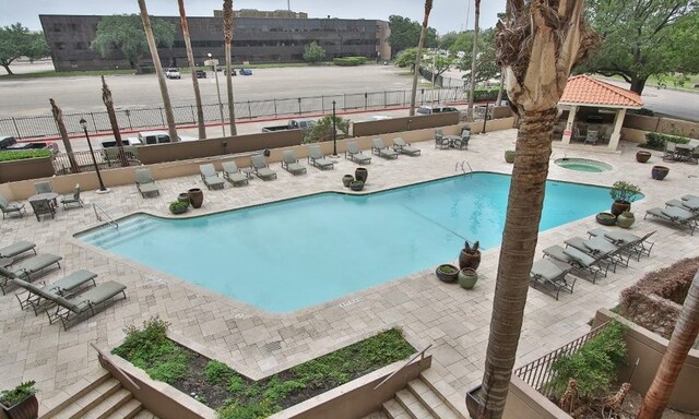 view of swimming pool with a patio area