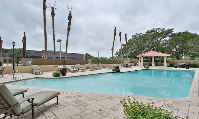 view of pool featuring a patio and a gazebo