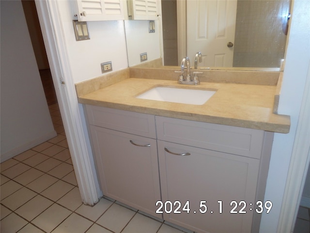 bathroom with tile flooring and oversized vanity